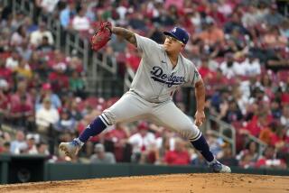 Los Angeles Dodgers starting pitcher Julio Urias throws during the first inning.