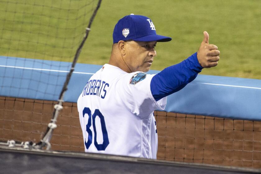 LOS ANGELES, CALIF. -- SUNDAY, OCTOBER 28, 2018: Dodgers manager Dave Roberts gives a thumbs up during game 5 of the World Series against the Red Sox at Dodger Stadium in Los Angeles, Calif., on Oct. 28, 2018. (Allen J. Schaben / Los Angeles Times)
