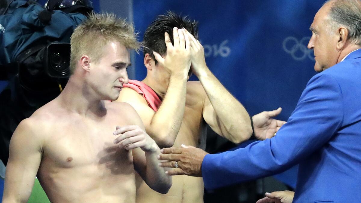 Britain's Jack Laugher and Chris Mears react after clinching the gold medal in the men's synchronized three-meter springboard diving competition Wednesday.