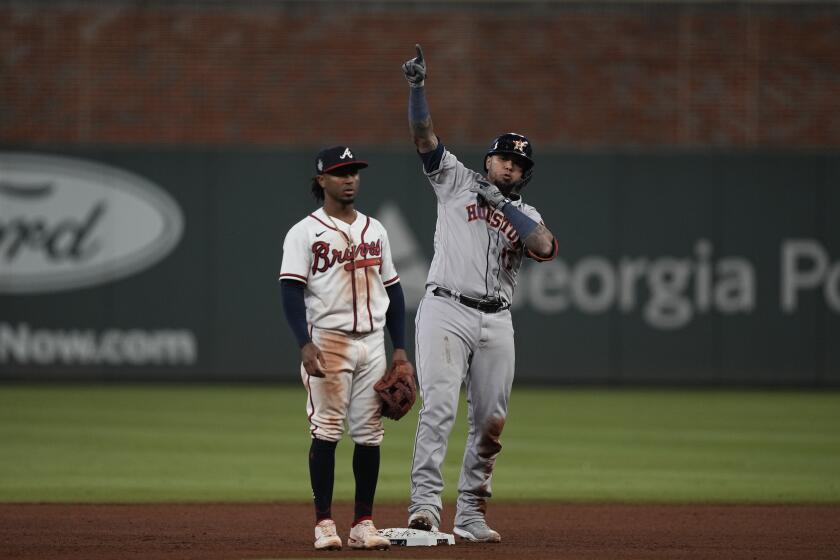 The Astros' Martin Maldonado celebrates after his RBI-single during the seventh inning of Game 5 of the World Series