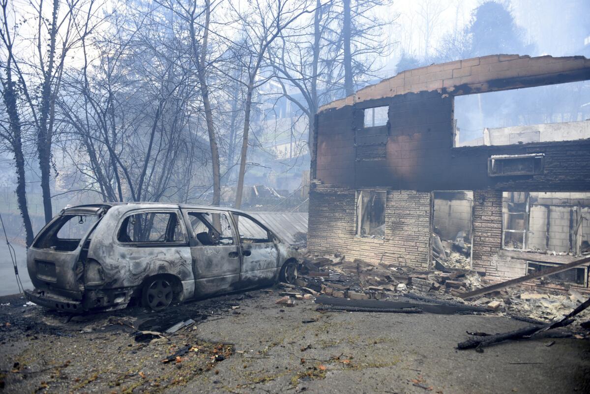 A home and van destroyed by fires raging around Gatlinburg, Tenn., on Nov. 29.