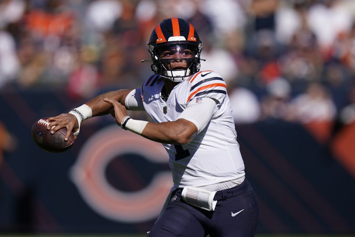 Chicago Bears quarterback Justin Fields passes during the first half of an NFL football game against the Green Bay Packers Sunday, Oct. 17, 2021, in Chicago. (AP Photo/Nam Y. Huh)