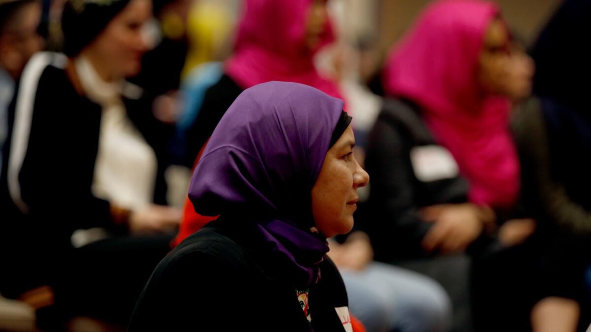 Lucy Silva participates in the #IStandWithHijabis event at the Islamic Society of Orange County in Garden Grove. (Francine Orr / Los Angeles Times)