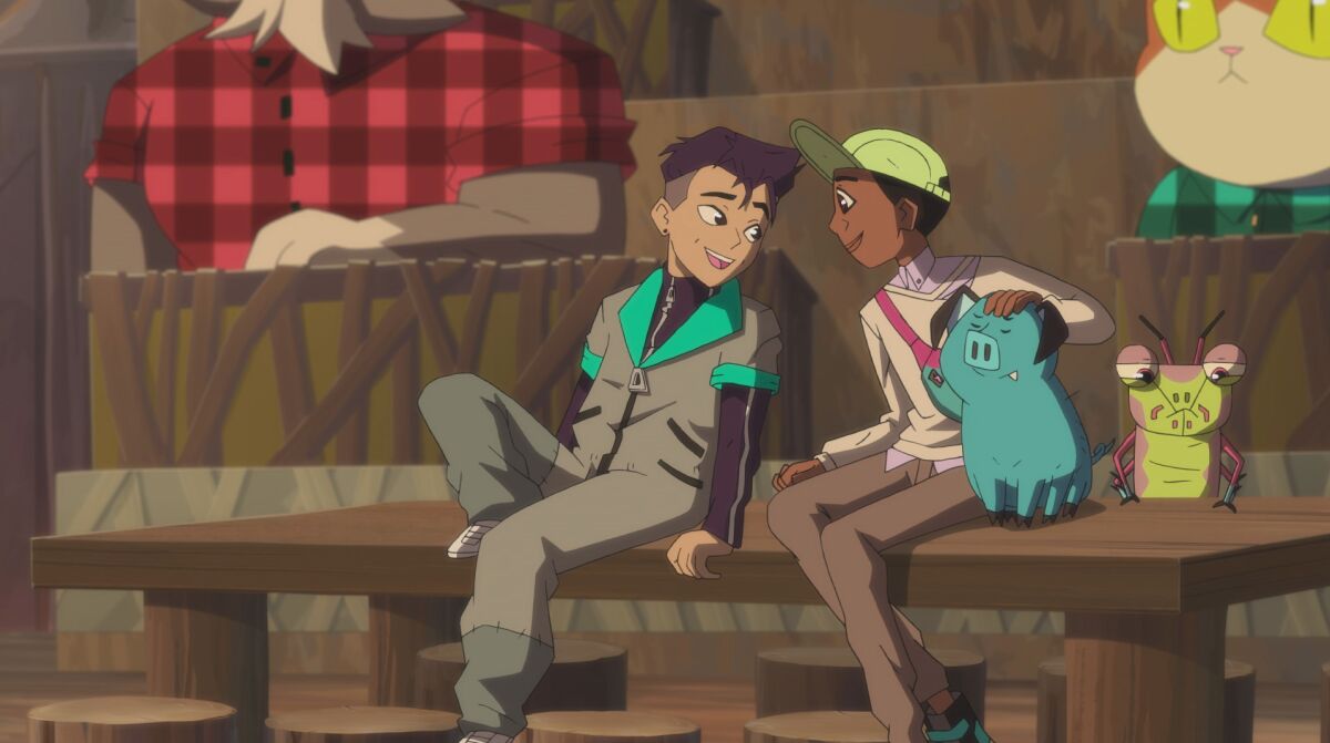 Two boys on a bench talking to each other 