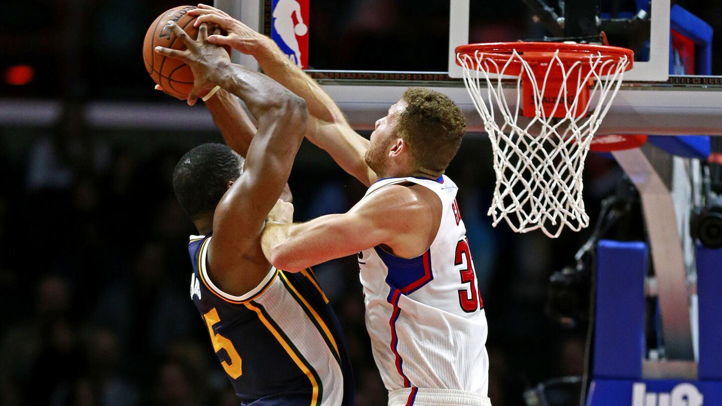 Clippers forward Blake Griffin (32) tries to block a shot by Jazz forward Derrick Favors, who managed to score on the play in the fourth quarter.