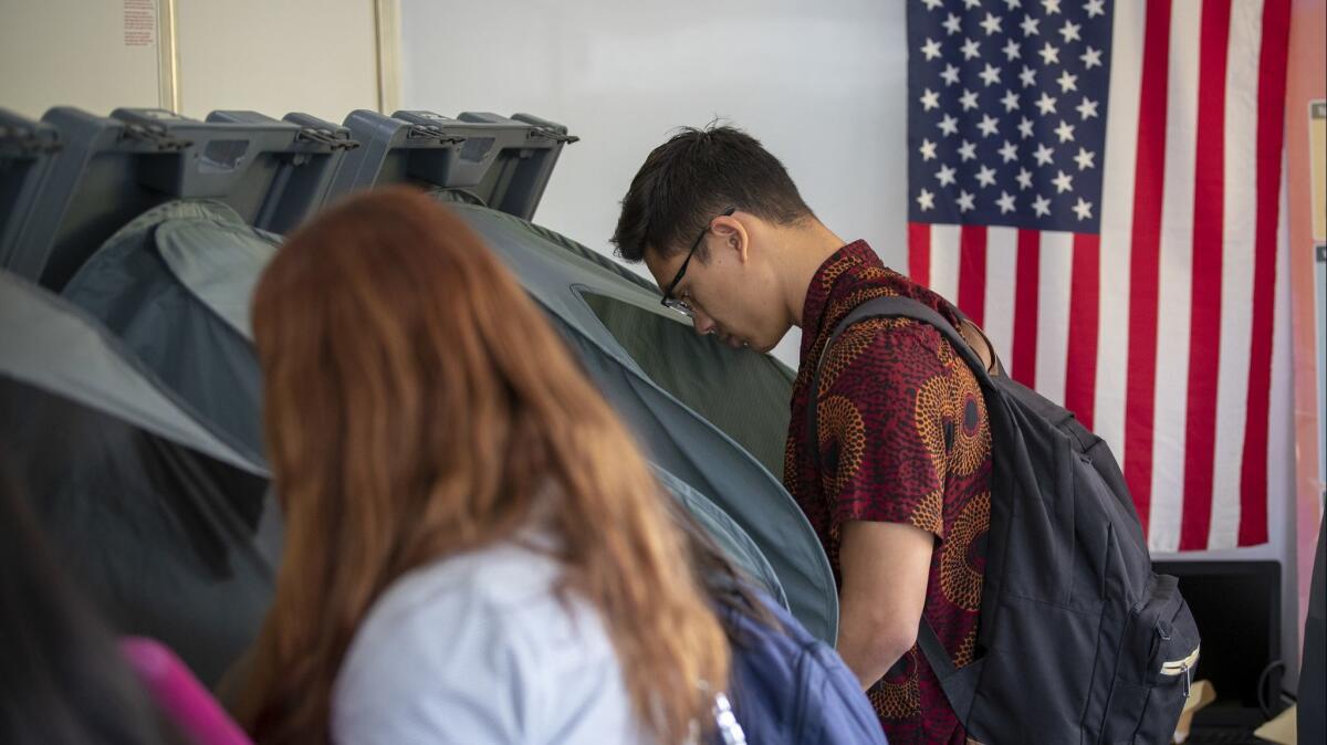 With election day looming, people cast their ballots for the 2018 midterm elections at the early voting center at the University of California Irvine campus on Oct. 30.