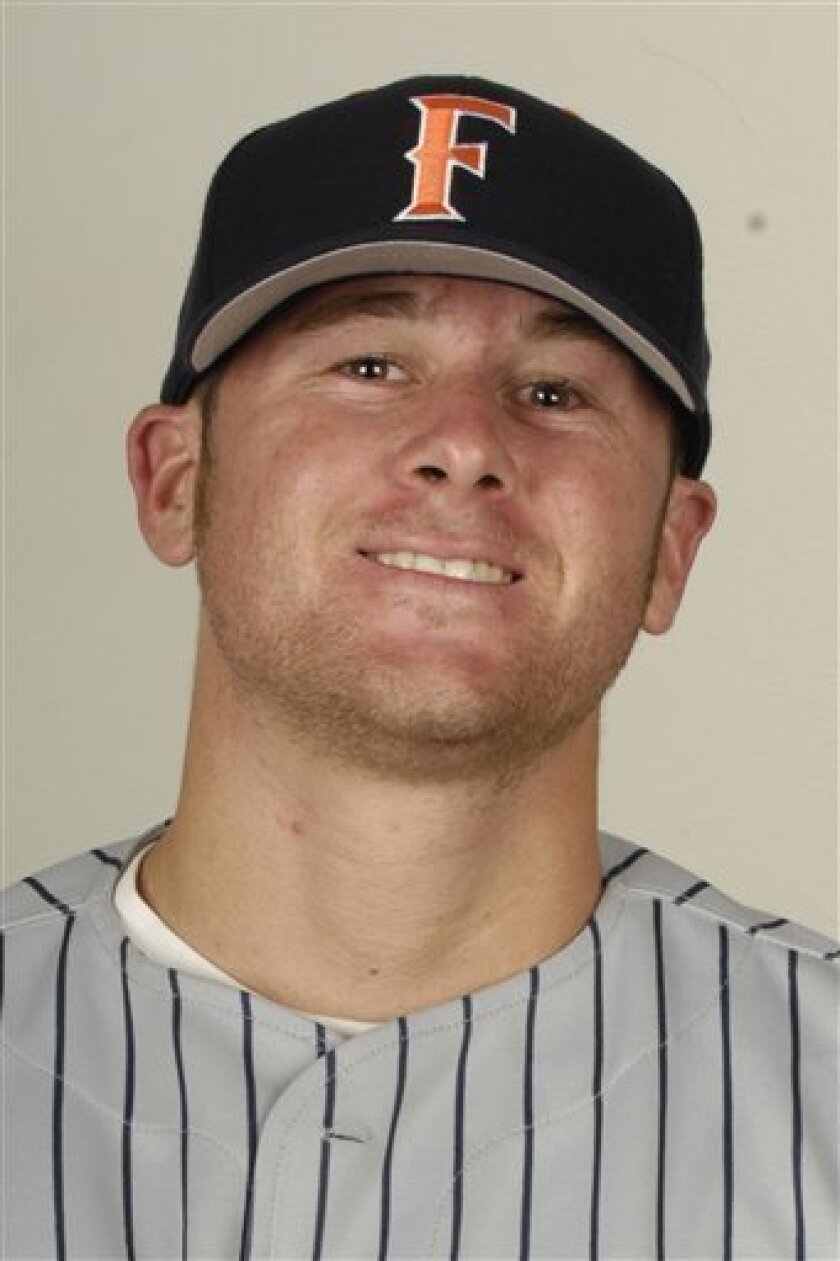 This undated photo provided by Cal State Fullerton on Thursday, April 9, 2009, shows former student athlete Jon Wilhite in his Titan baseball uniform. Wilhite, 24, was in critical condition Thursday, recovering from injuries suffered in the early-morning hit-and-run accident that killed Los Angeles Angels' pitcher Nick Adenhart and two others including Cal State Fullerton student Courtney Stewart, in Fullerton, Calif. (AP Photo/Cal State Fullerton)