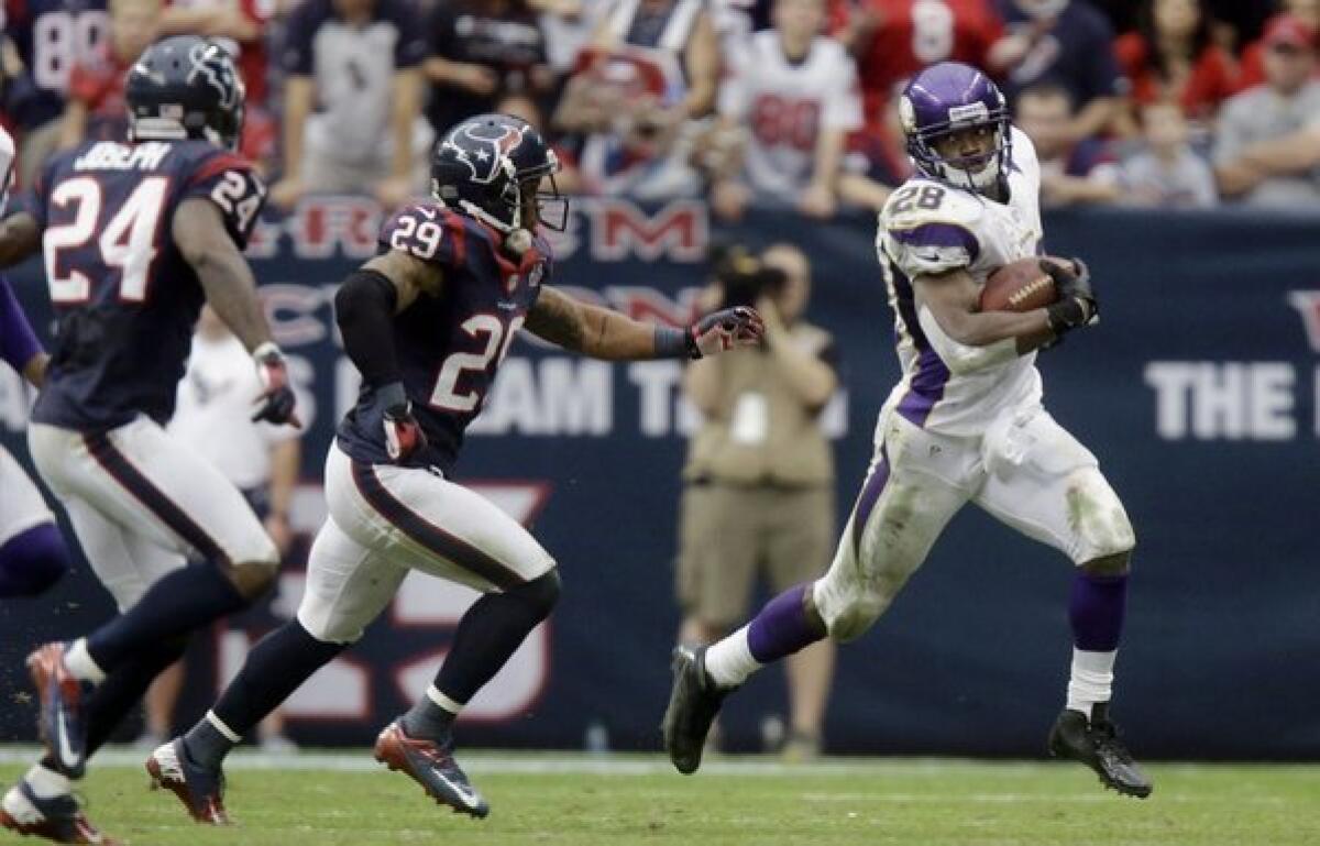 Adrian Peterson rushes against the Houston Texans.