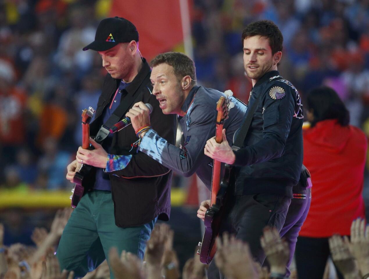 Chris Martin, lead singer of Coldplay, performs with the band during the half-time show at the NFL's Super Bowl 50 between the Carolina Panthers and the Denver Broncos in Santa Clara