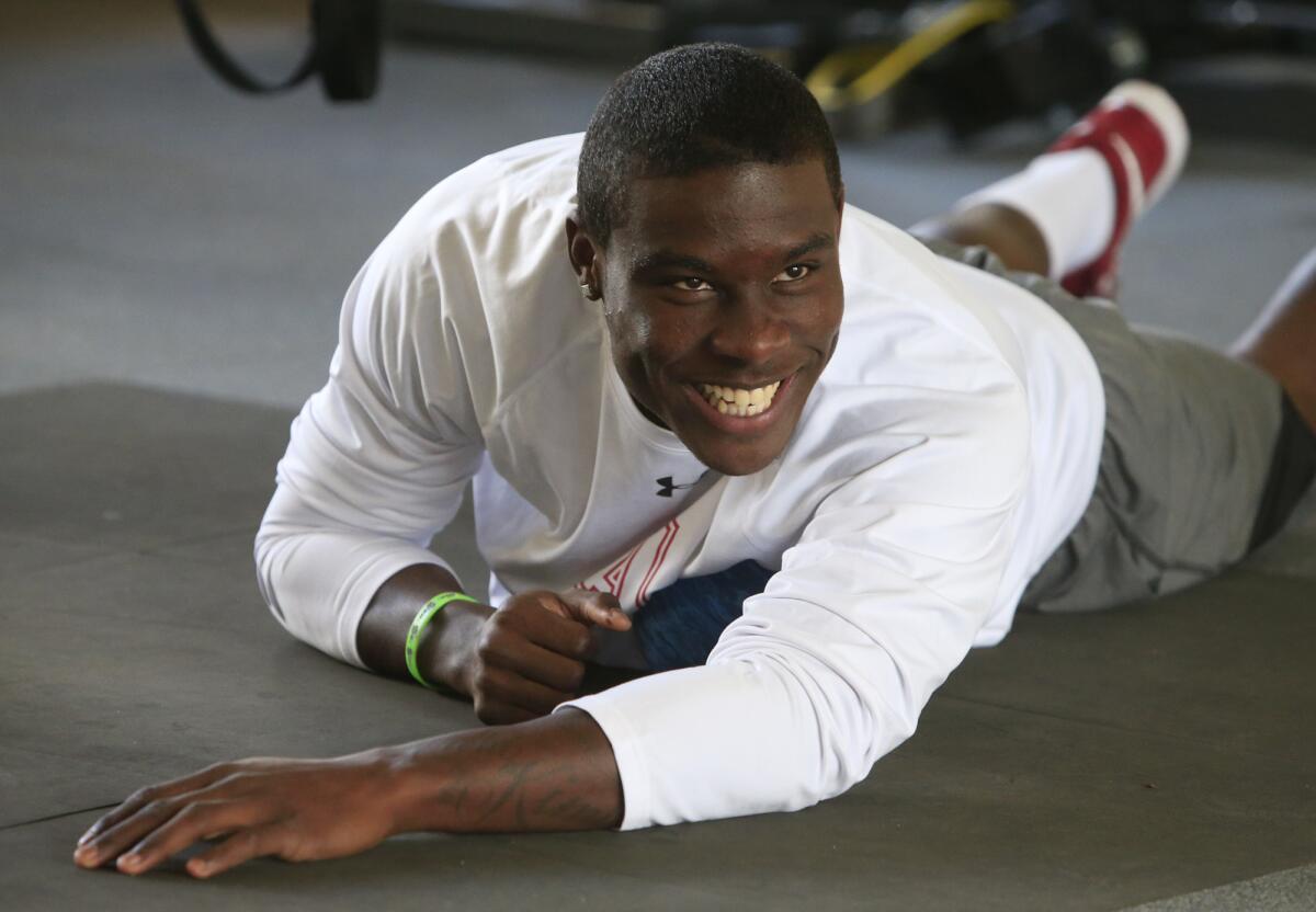 Dion Bailey stretches at the Santora Elite Training Center at UC Irvine in February 2014.
