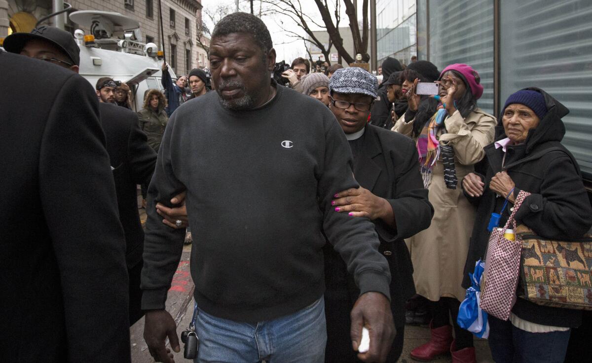 Benjamin Carr, stepfather of Eric Garner, leaves the district attorney's office on Dec. 3 after a grand jury decided not to indict the officer accused of putting the unarmed Garner in a fatal chokehold.