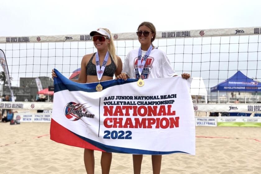 Erin Inskeep, right, and Ashley Pater celebrate after winning the AAU Beach 18U national championship in Hermosa Beach.