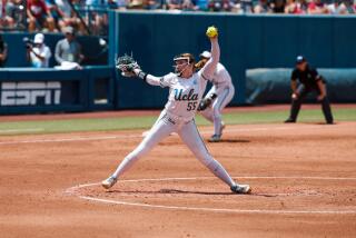 UCLA pitcher Kaitlyn Terry delivers against Oklahoma in the Women's College World Series on June 1, 2024.