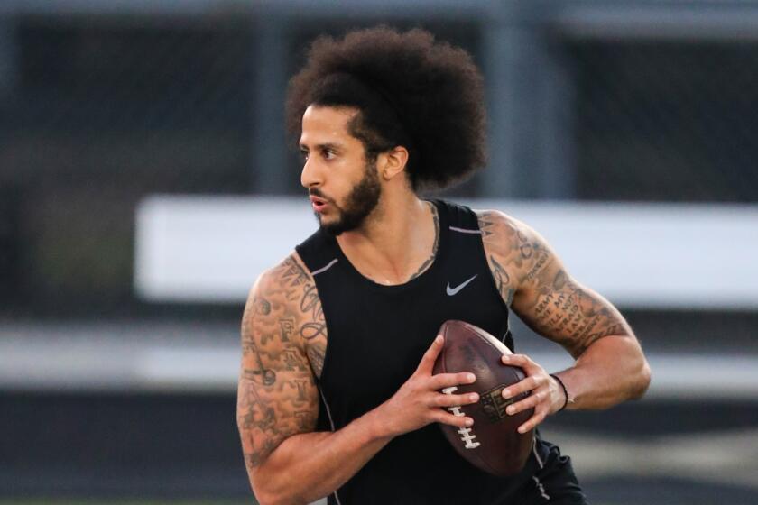 RIVERDALE, GA - NOVEMBER 16: Colin Kaepernick looks to make a pass during a private NFL workout held at Charles R Drew high school on November 16, 2019 in Riverdale, Georgia. Due to disagreements between Kaepernick and the NFL the location of the workout was abruptly changed. (Photo by Carmen Mandato/Getty Images)