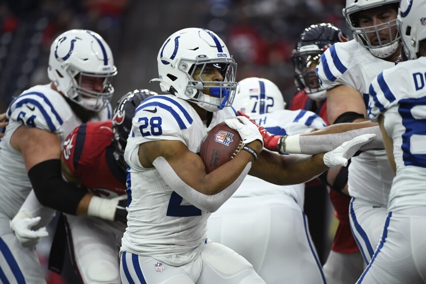 Indianapolis Colts running back Jonathan Taylor (28) scores on a touchdown run against the Houston Texans during an NFL football game, Sunday, Dec. 5, 2021, in Houston. (AP Photo/Justin Rex )