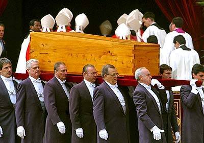 The coffin containing the body of John Paul II is taken into St. Peter's Basilica for burial.