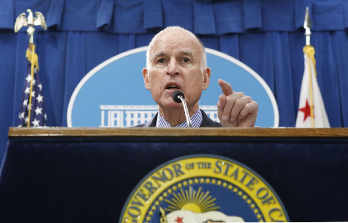 Gov. Jerry Brown responds to a question on his revised budget plan on May 14.