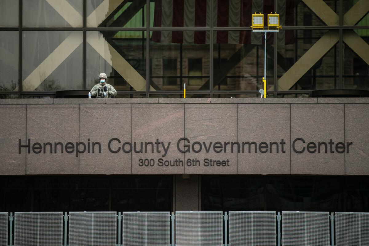 A National Guard stands watch at Hennepin County Government Center 