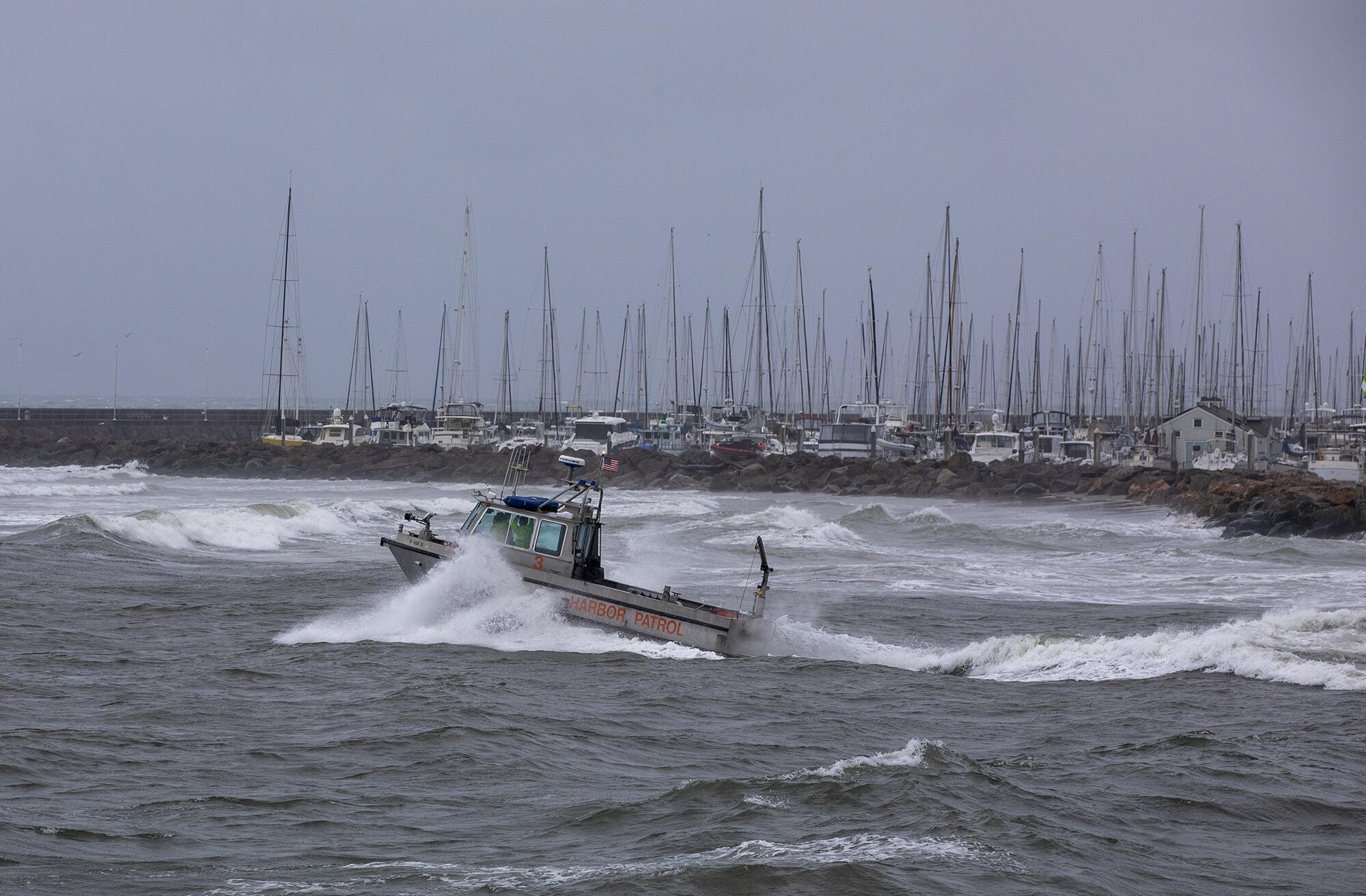 A boat heads out into choppy waters near Stearns Wharf in Santa Barbara on Friday.