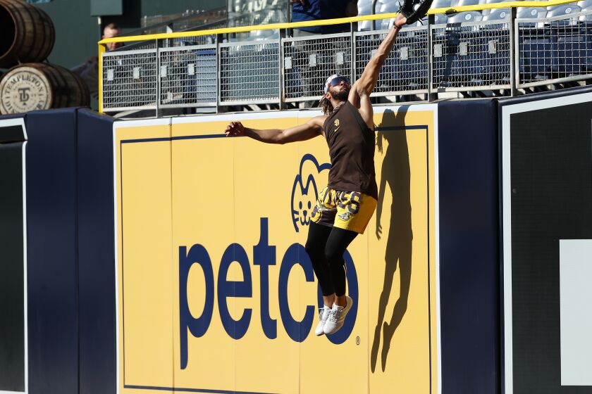San Diego Padres Fernando Tatis Jr. catches a ball in right field