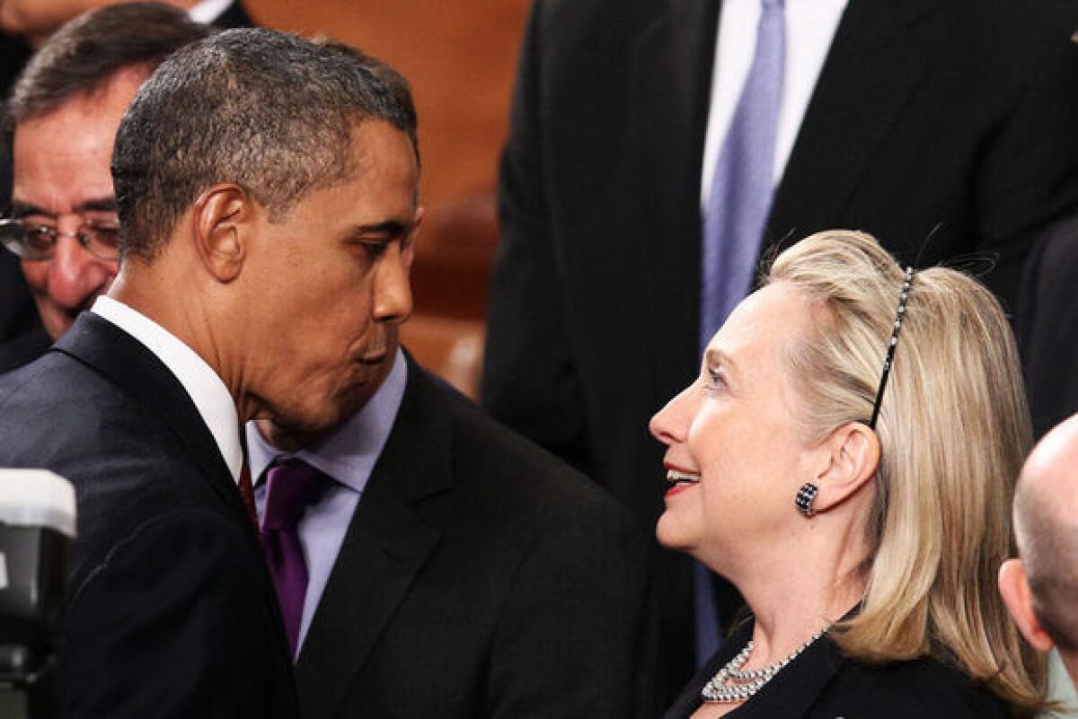 President Obama greets Secretary of State Hillary Rodham Clinton at his State of the Union address on Tuesday.