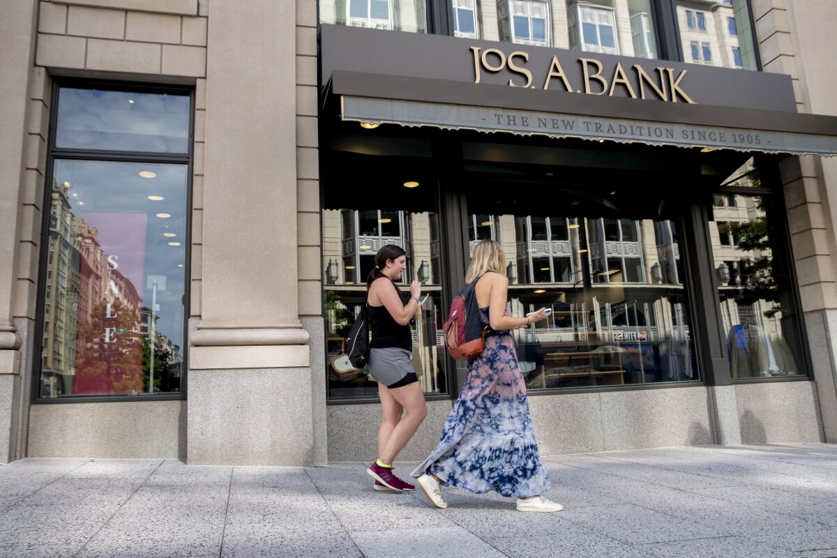 A JoS. A. Bank clothing chain location in Washington, Monday, Aug. 3, 2020. Tailored Brands, known for its clothing chains Men's Wearhouse and JoS. A. Bank, struggled as the pandemic shut stores and consumer demand for office attire dropped, has filed for bankruptcy. (AP Photo/Andrew Harnik)
