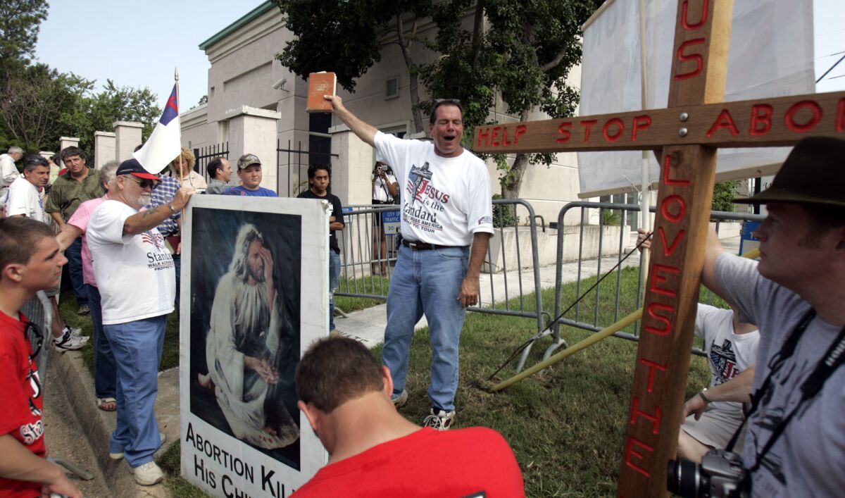 Flip Benham, director of the Christian fundamentalist anti-abortion group, Operation Save America, organized the disruption of Sunday services at the First Unitarian Universalist Church of New Orleans on July 20, 2014. Here, he is shown outside Jackson Women's Health Organization, the only abortion clinic in Mississippi, on July 15, 2006.