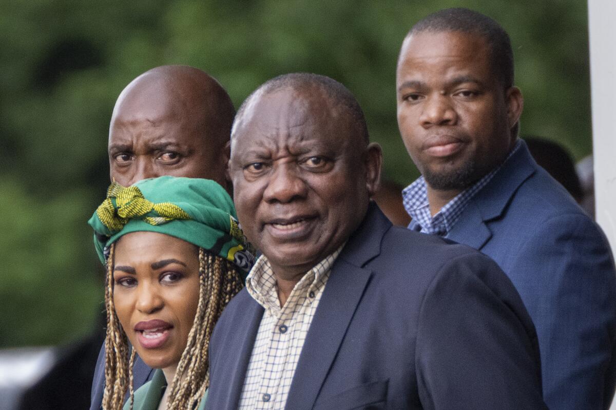 South African President Cyril Ramaphosa leaving a political gathering