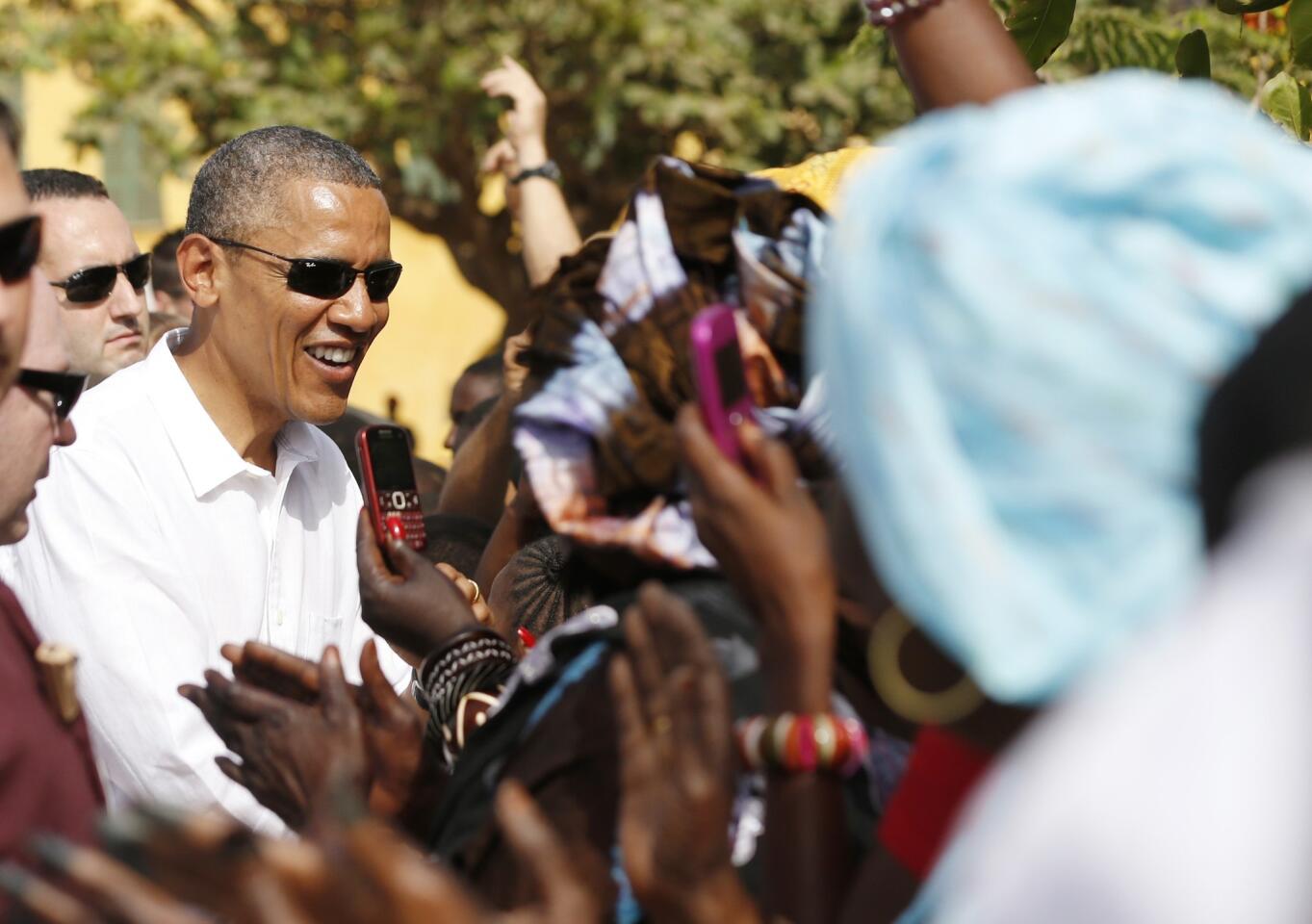 U.S. President Barack Obama greets well-wishers during his visit to Goree Island near Dakar