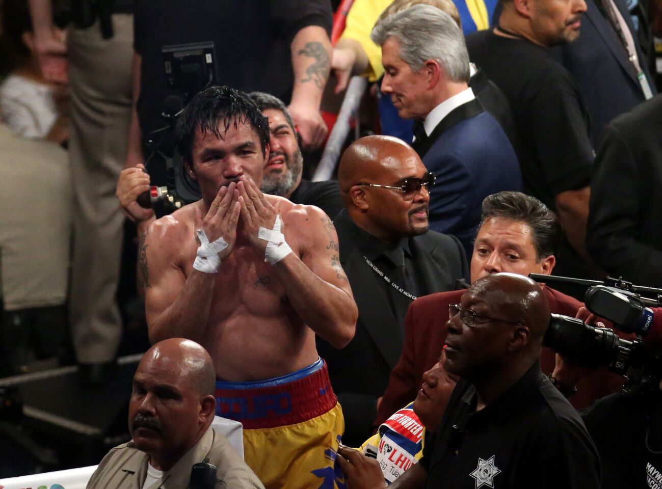 Manny Pacquiao salutes the crowd after fighting 12 rounds with Floyd Mayweather on Saturday night.