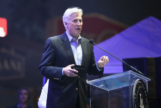 Dodgers owner Mark Walter speaks at a gala.