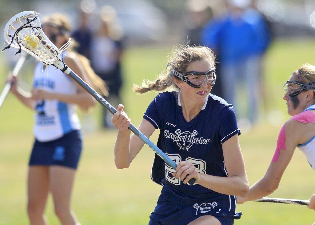 Newport Harbor High's Rylie Siegfried competes against Corona del Mar during the Battle of the Bay game on Friday.