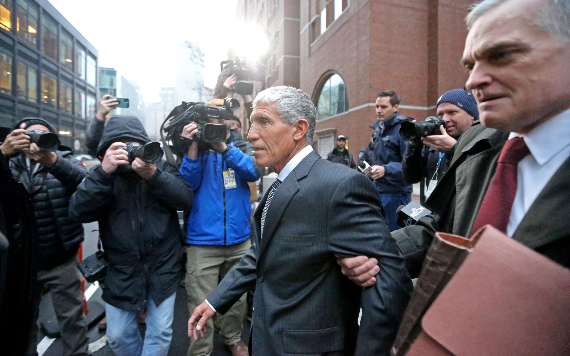 William Rick Singer leaves the Moakley Courthouse after being sentenced to 3.5 years in jail on January 4, 2023 in Boston.