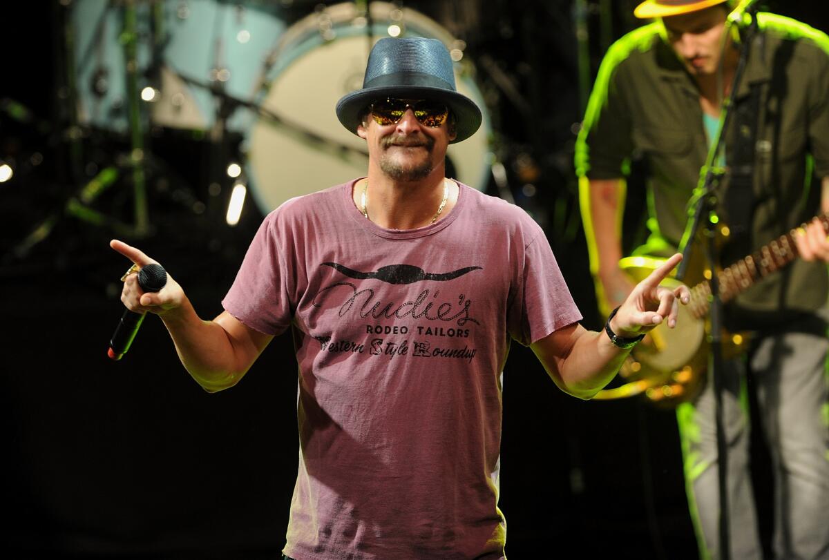 This May 5, 2015 file photo shows musician Kid Rock performing during National Concert Day in New York. Activists in Detroit trying to persuade Kid Rock to stop displaying the Confederate flag at concerts plan to meet this week with General Motors over the Chevrolet brand's sponsorship of the musician's summer tour.