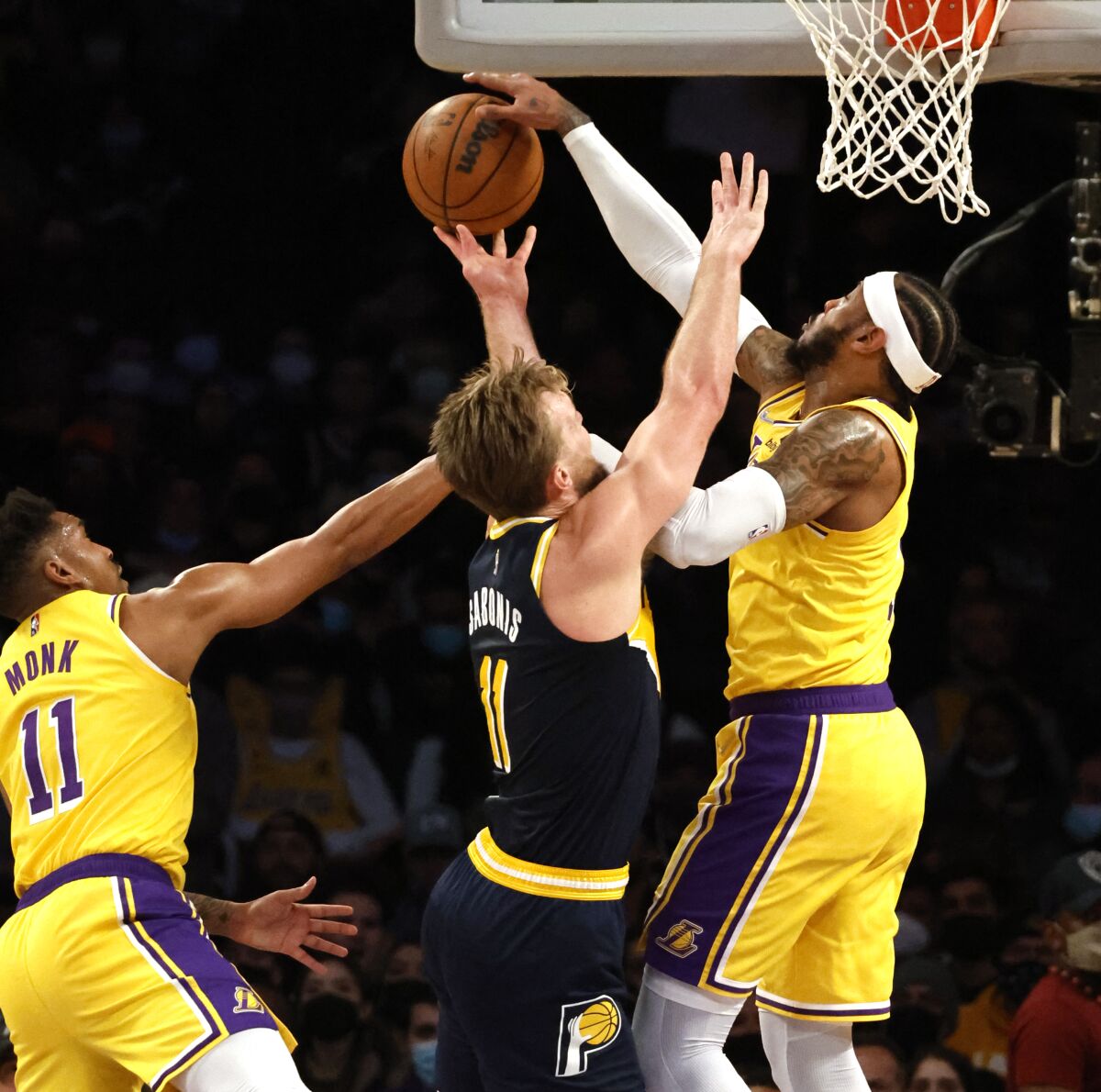Carmelo Anthony blocks the shot of Pacers forward Domantas Sabonis in the first half.