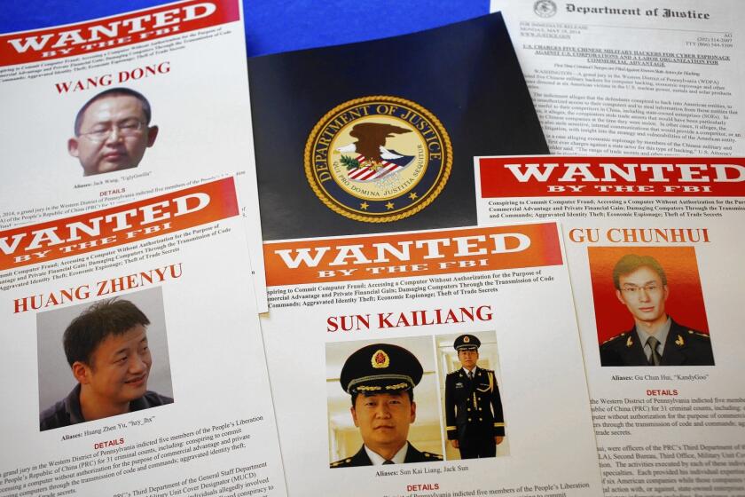 The U.S. government indictment of five Chinese military officials on cyberspying charges includes the names, photos, Internet handles, unit and building address of the alleged conspirators in Shanghai.