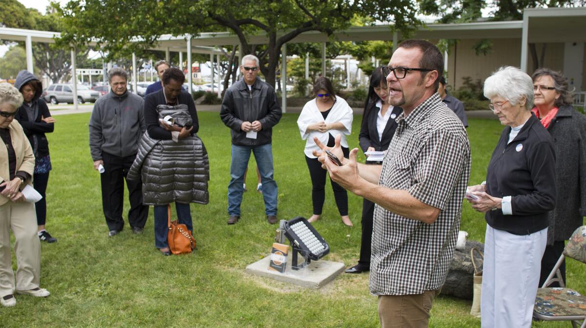 Ian Stevenson, Trellis executive director, addresses a group during National Day of Prayer at Costa Mesa City Hall on Thursday.