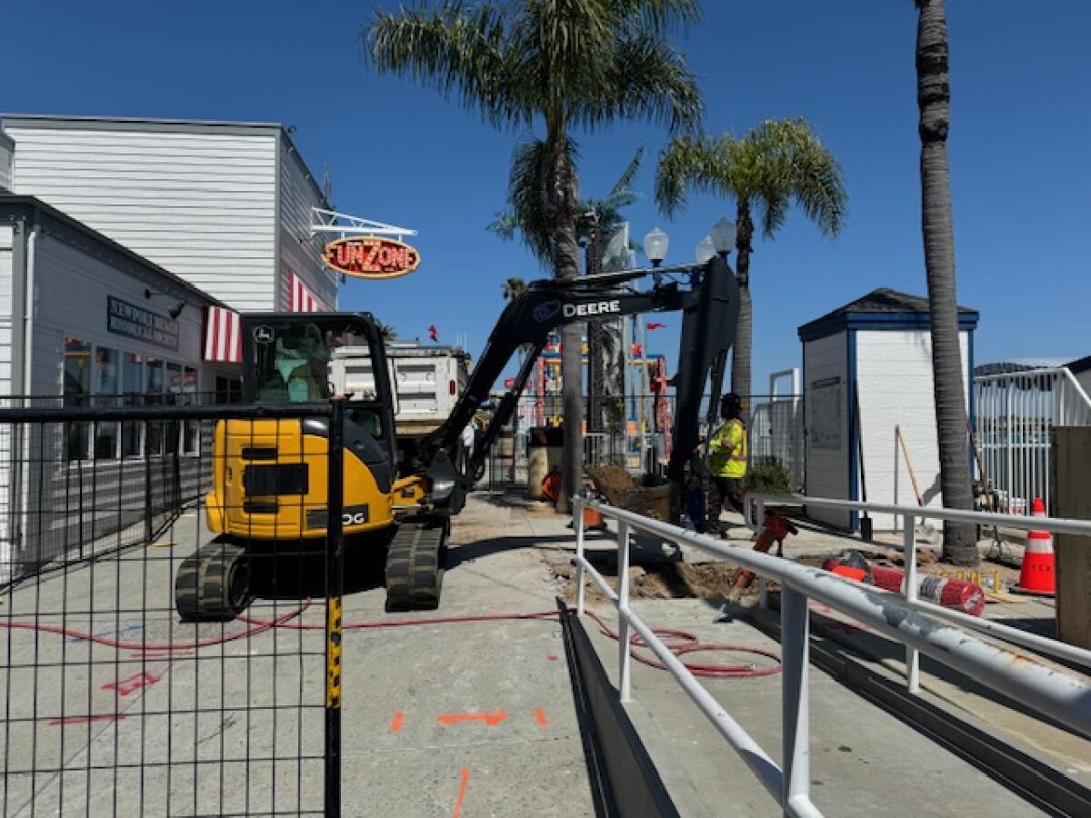 A digging crane sits at the Balboa Fun Zone.