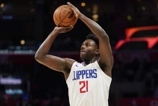 Los Angeles Clippers guard Kobe Brown shoots during the second half of an NBA basketball game against the Denver Nuggets, Thursday, Oct. 19, 2023, in Los Angeles. (AP Photo/Ryan Sun)