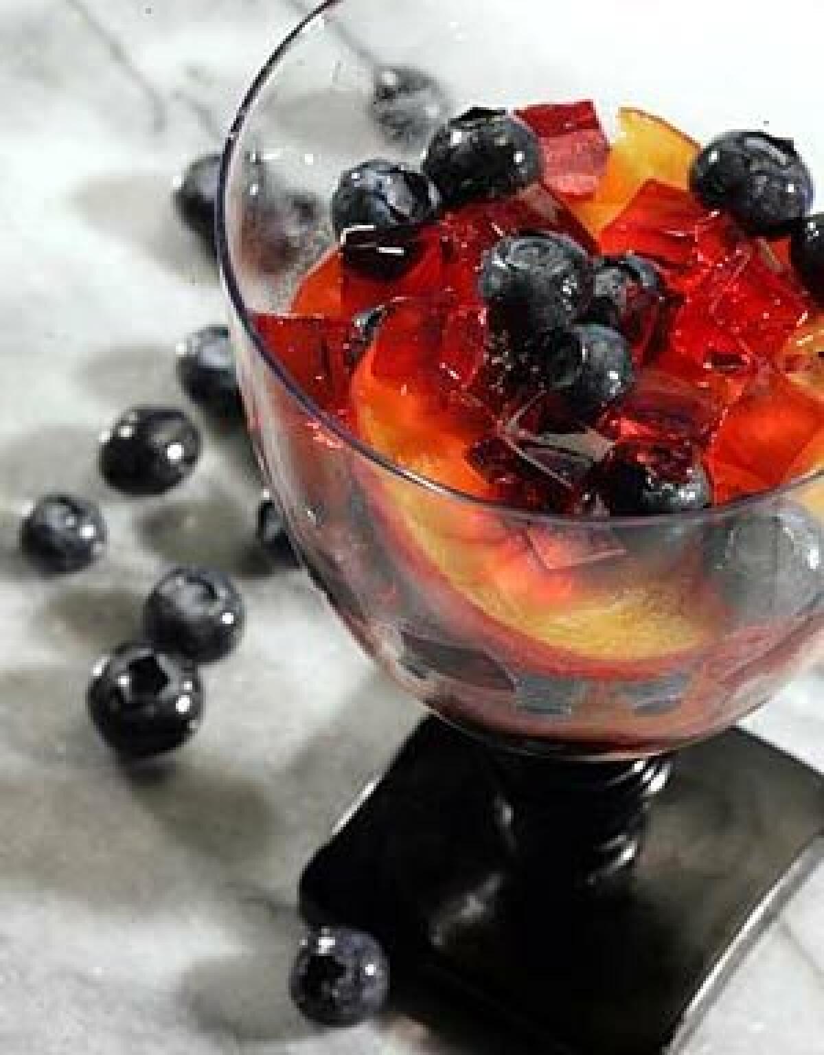 COOL AND SOPHISTICATED: Cubes of rose-flavored jelly layered with nectarines and blueberries create the taste of summer in a glass.