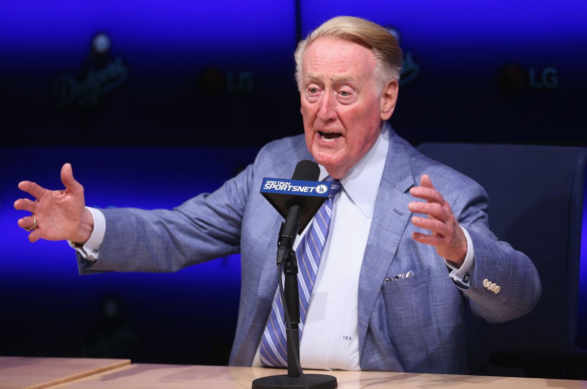Former Dodgers announcer Vin Scully speaks during a news conference in 2014.