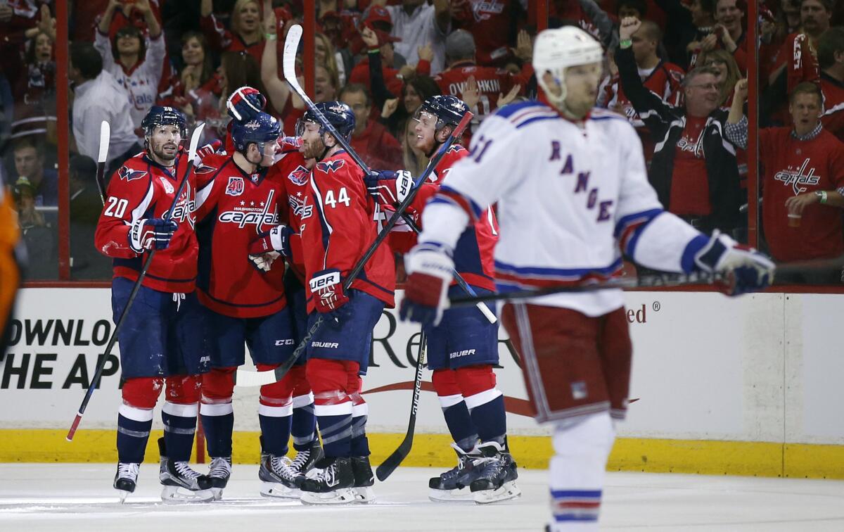 The Capitals celebrate around center Jay Beagle (83) after his second period goal in Game 3 of the second round playoffs against the New York Rangers. The Capitals won 1-0.