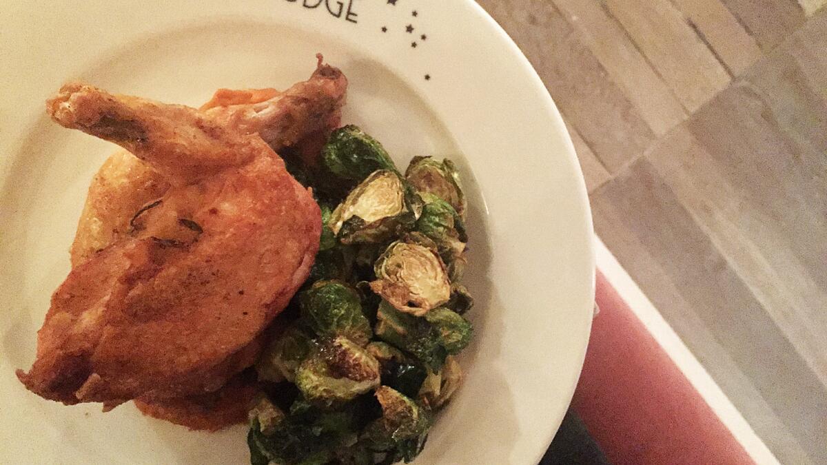 The roast chicken with sweet carrot mash and crispy Brussels sprouts at Au Fudge.