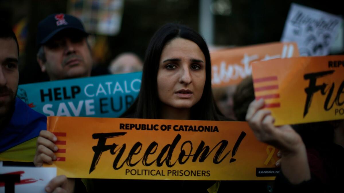 Demonstrators in Barcelona, Spain, gather during a protest calling for the release of Catalan jailed politicians on Saturday, Nov. 11, 2017.