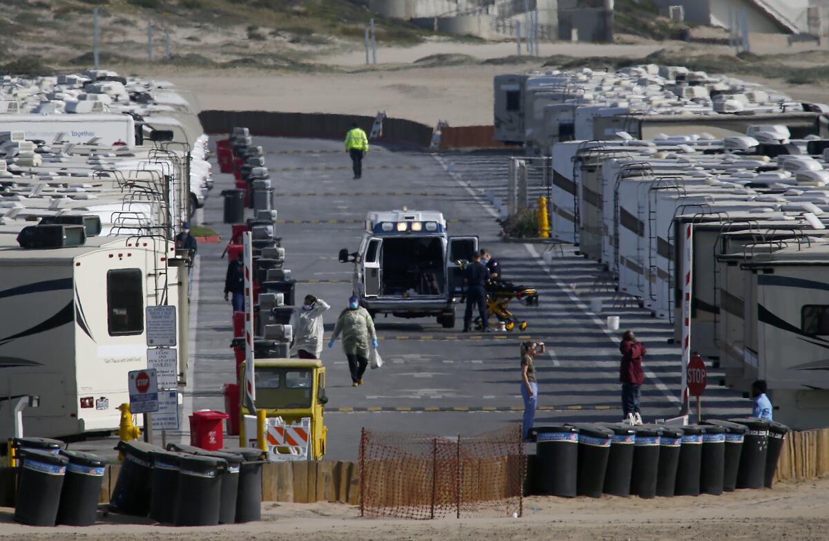 More than 100 recreational vehicles parked in a lot at Dockweiler State Beach are being used to house people who have tested positive for or have symptoms of COVID-19.