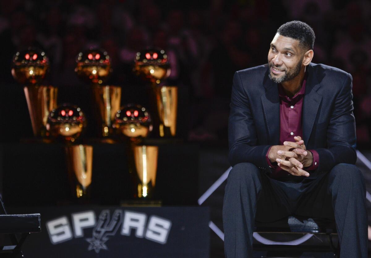 Retired Spurs forward Tim Duncan listens while special guests speak about him during his jersey retirement ceremony on Dec. 18.