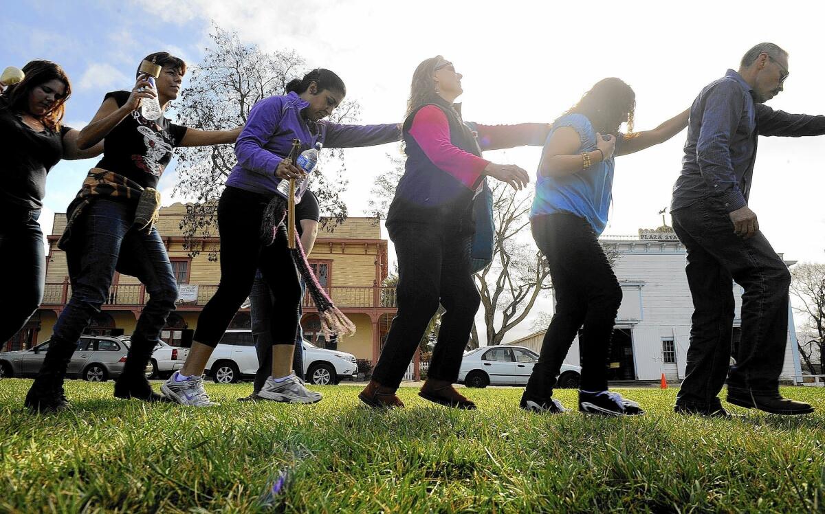 Participants dance in a circle during a rain dance in San Juan Bautista, Calif., recently. The group meets every Sunday until the worst of the California drought ends.