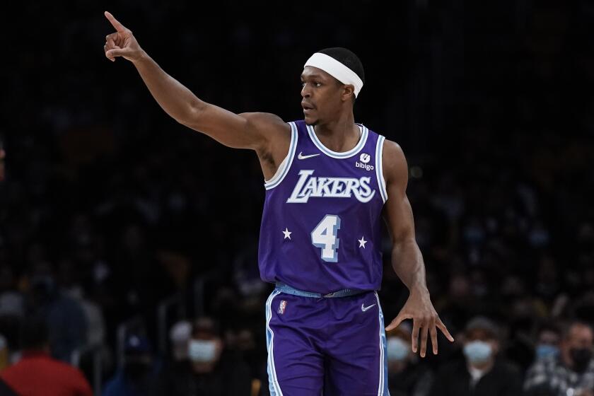 Laker Rajon Rondo dribbles the ball up the court against the San Antonio Spurs 