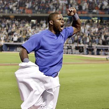 Dodger right fielder Milton Bradley yells at fans after being ejected in the 8th inning at Dodger Stadium after throwing a plastic bottle into the stands. A fan threw the bottle onto the field one play after Bradley dropped pinch-hitter Mark Sweeney's liner with the bases loaded, allowing two runs to score and giving the Rockies a 3-0 lead.