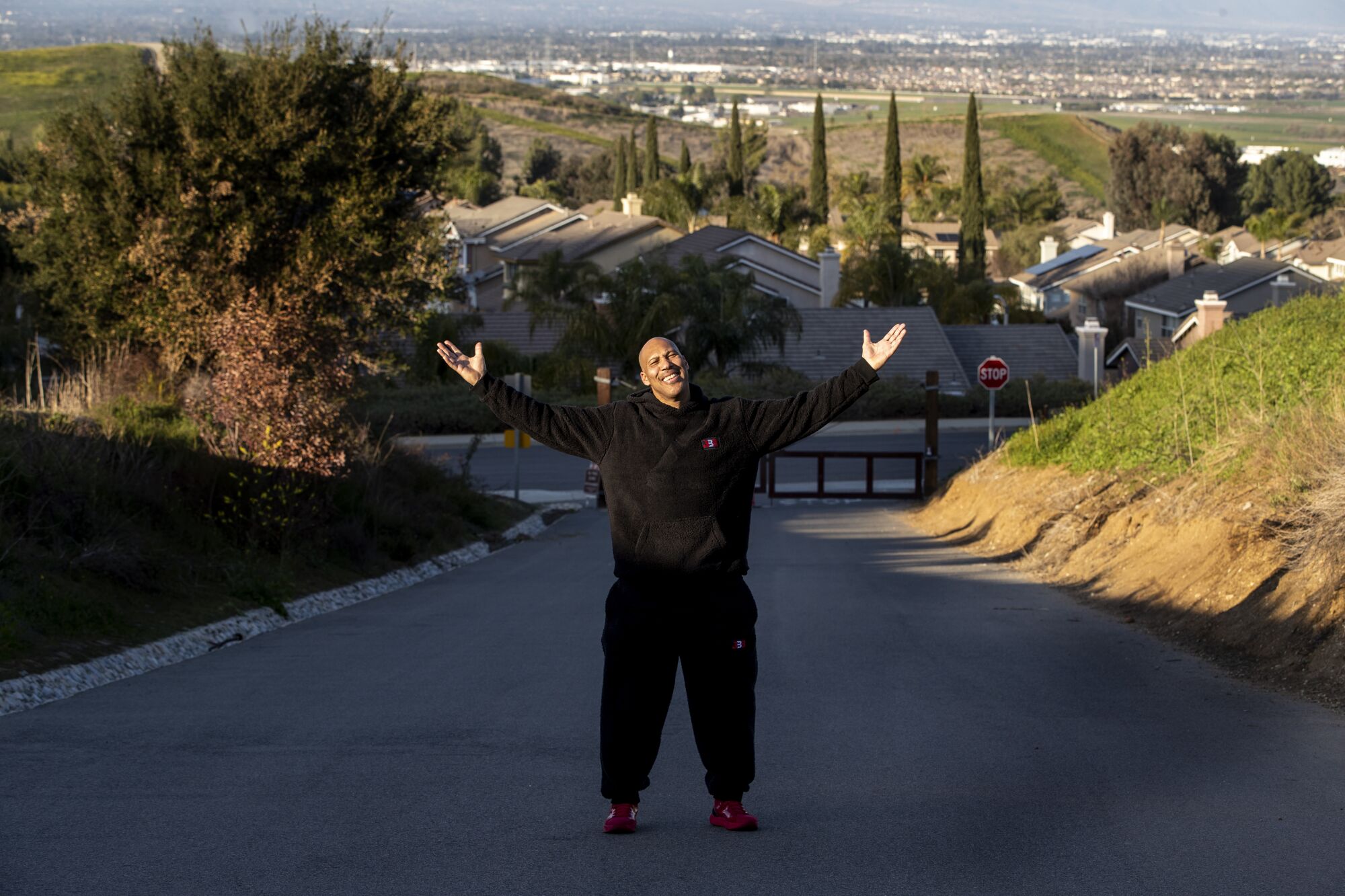 LaVar Ball stands on what was once a dirt path where he trained his sons near the north entrance of Chino Hills State Park.
